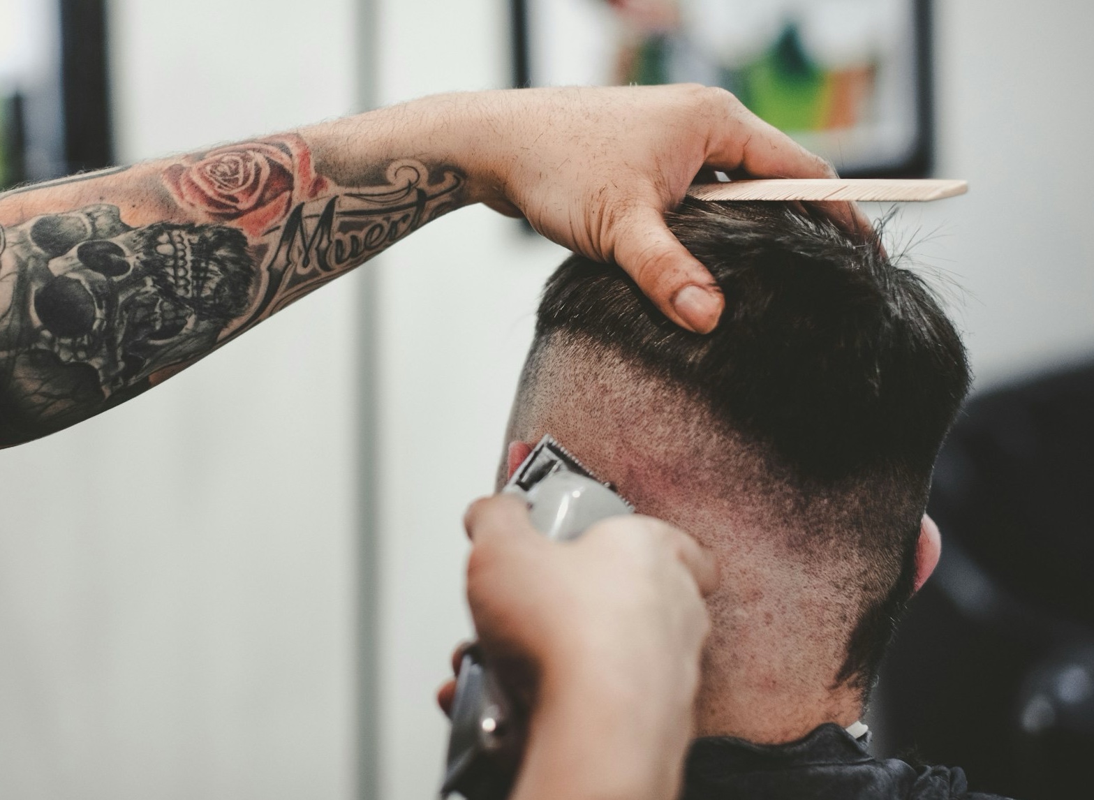 Another man getting his skin fade haircut